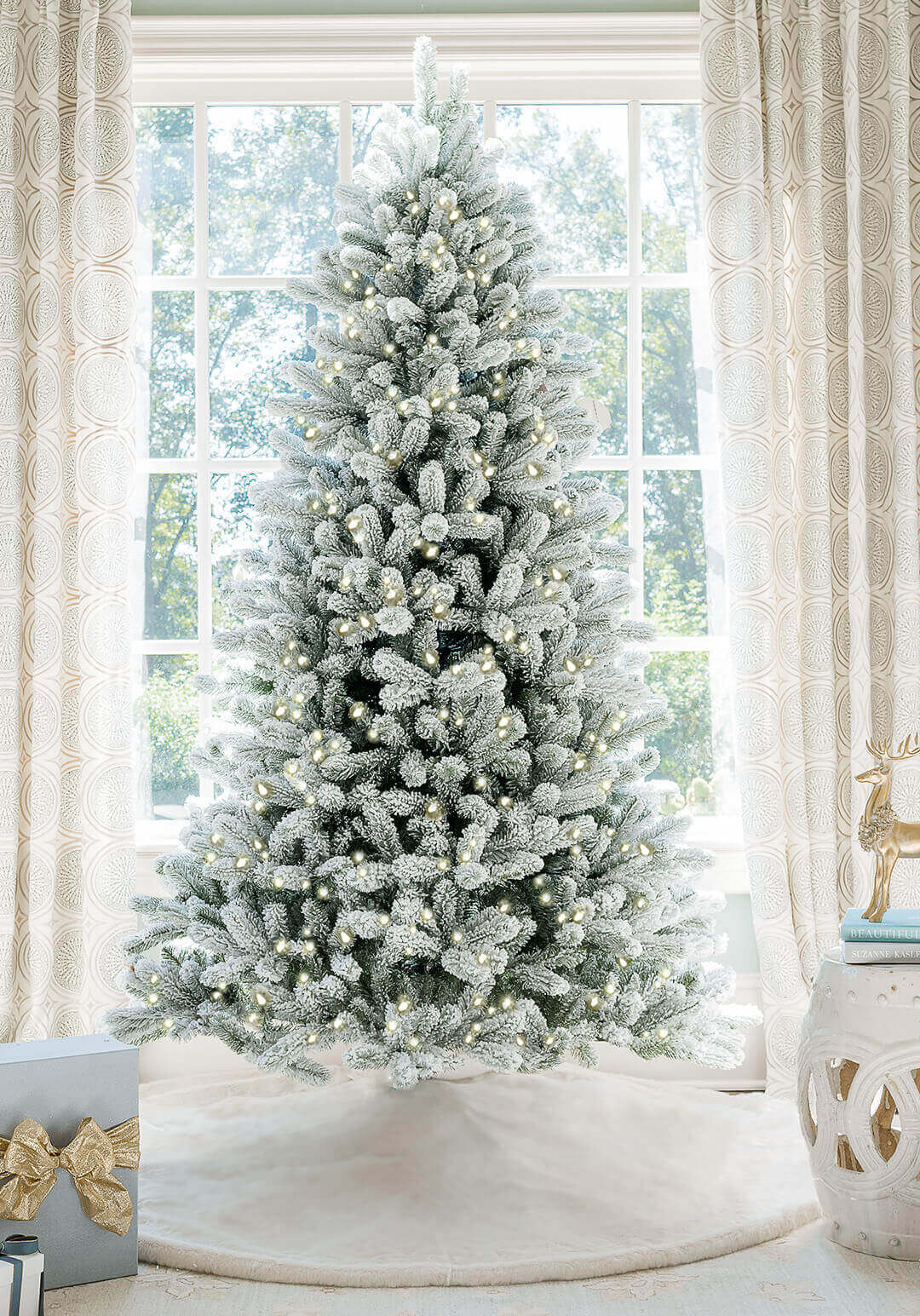 Flocked white Christmas tree with all white and silver decorations