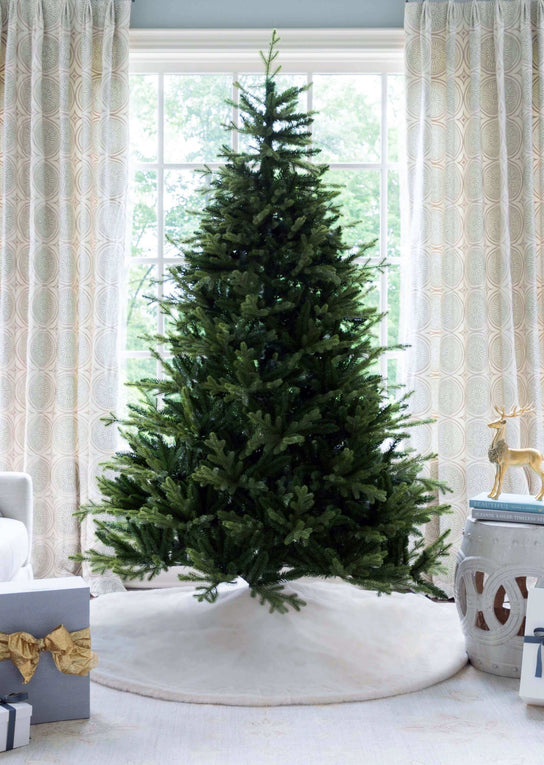 The easy-setup 9' Scarlet Fir Unlit Artificial Christmas Tree with realistic branches & soft tips.
