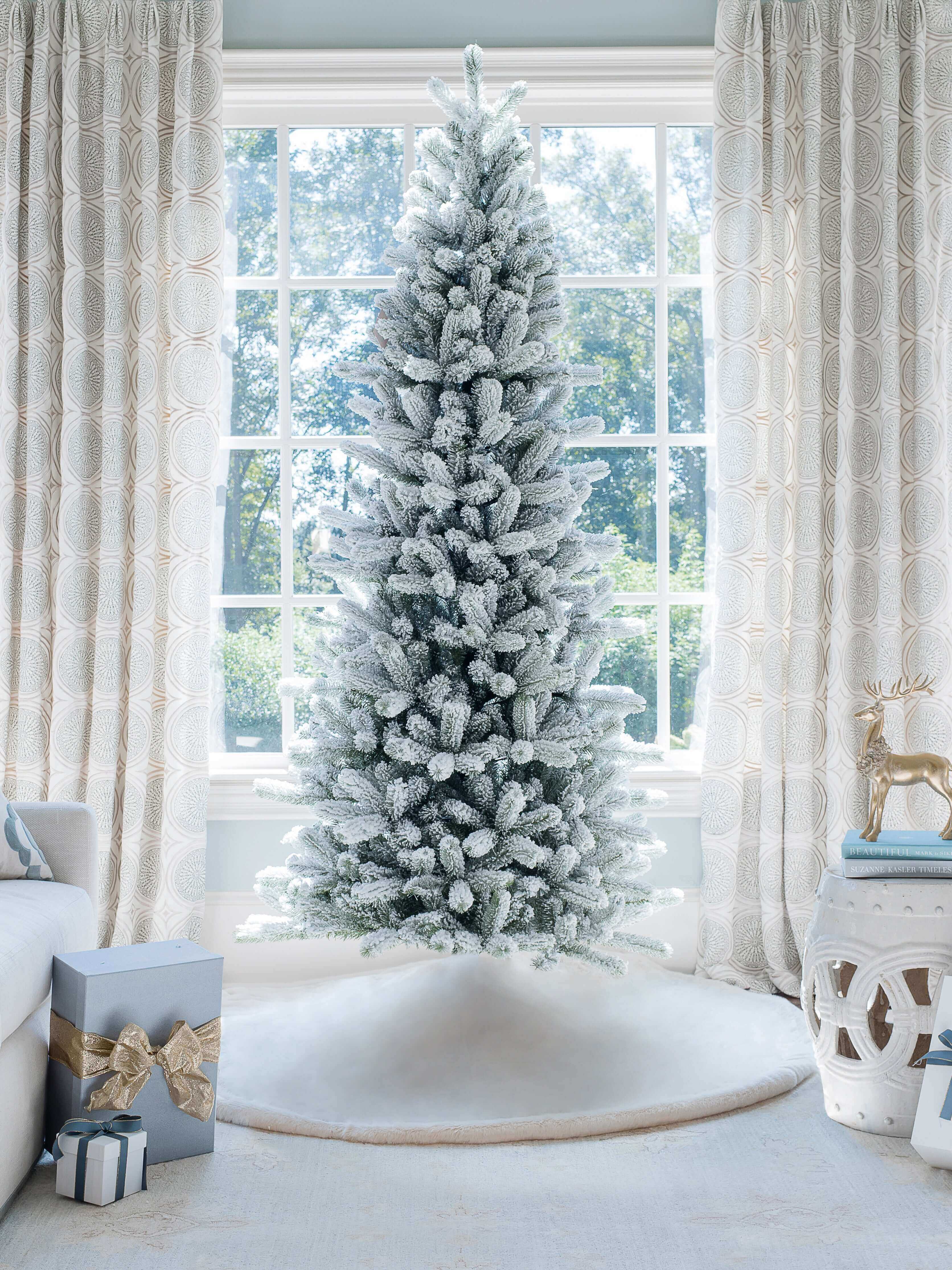 King of Christmas 10' King Flock® Slim Artificial Christmas Tree with 1000 Warm White LED Lights