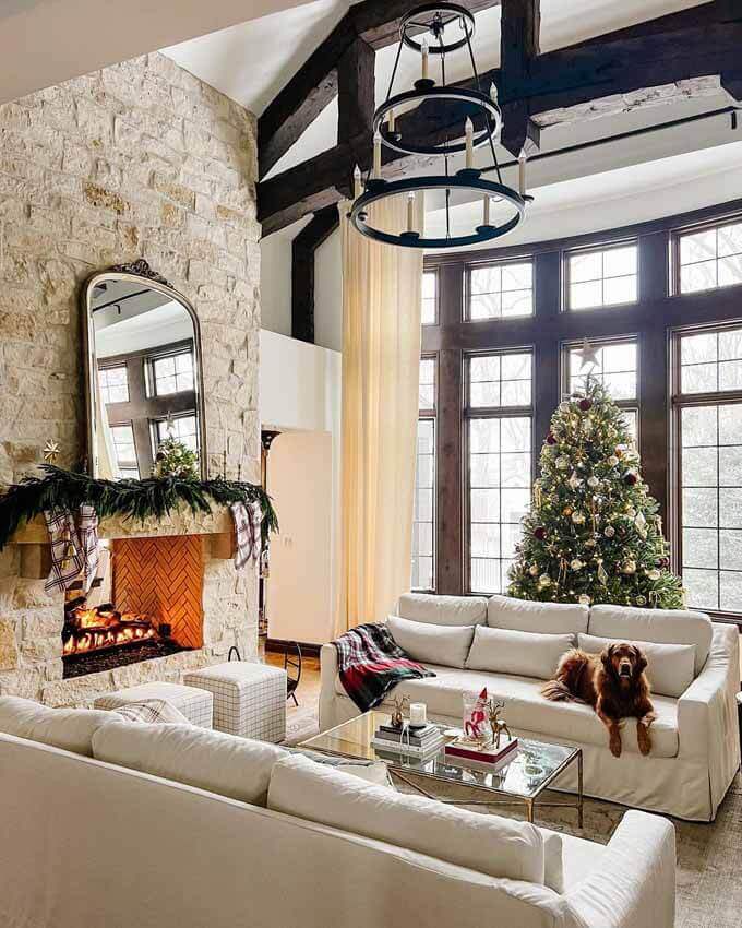 Bright living room with a tree beside a stone fireplace, King of Christmas customer photo by @thisprettylifexo