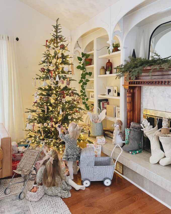 Living room with a lit tree and a toy car, King of Christmas customer photo by @ohhoneysilhouettes