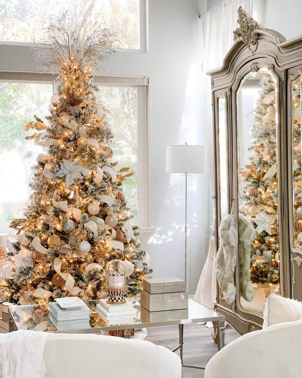Prince Flock artificial Christmas tree, decorated with gold ornaments beside a vintage armoire