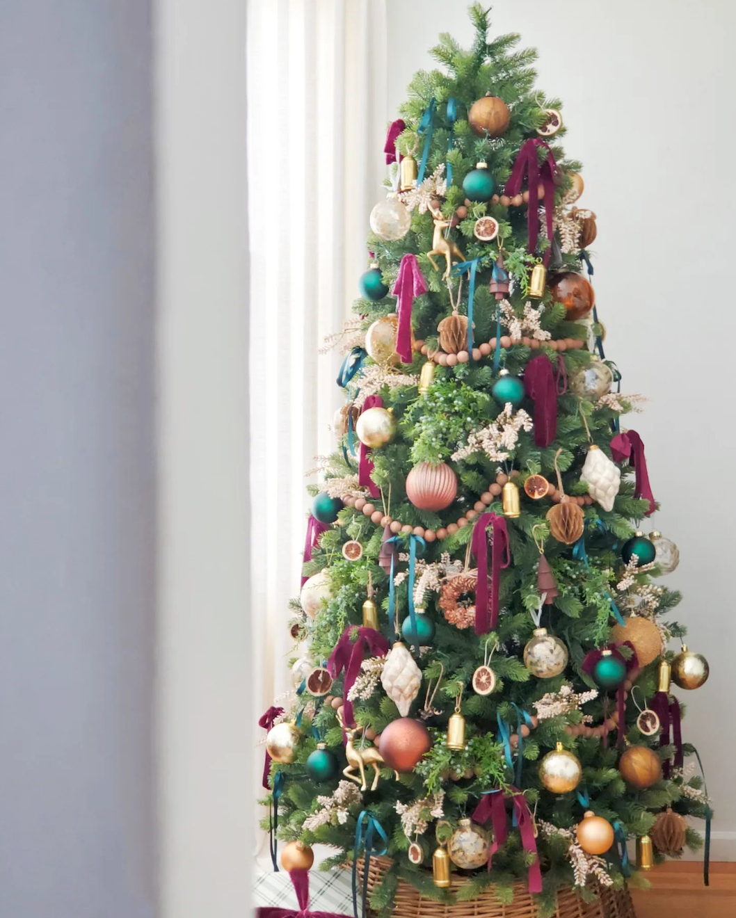 Royal Fir Slim artificial Christmas tree, decorated with burgundy and gold ornaments