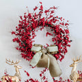 24 in Red Berry artificial Christmas wreath, unlit, with a cream ribbon bow between gold reindeer