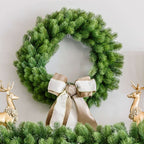 24 in Royal Fir artificial Christmas wreath, unlit, with a cream ribbon bow between gold reindeer