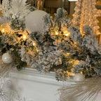 King of Christmas 9' x 12" King Flock® Garland with LED Lights (Battery Operated)