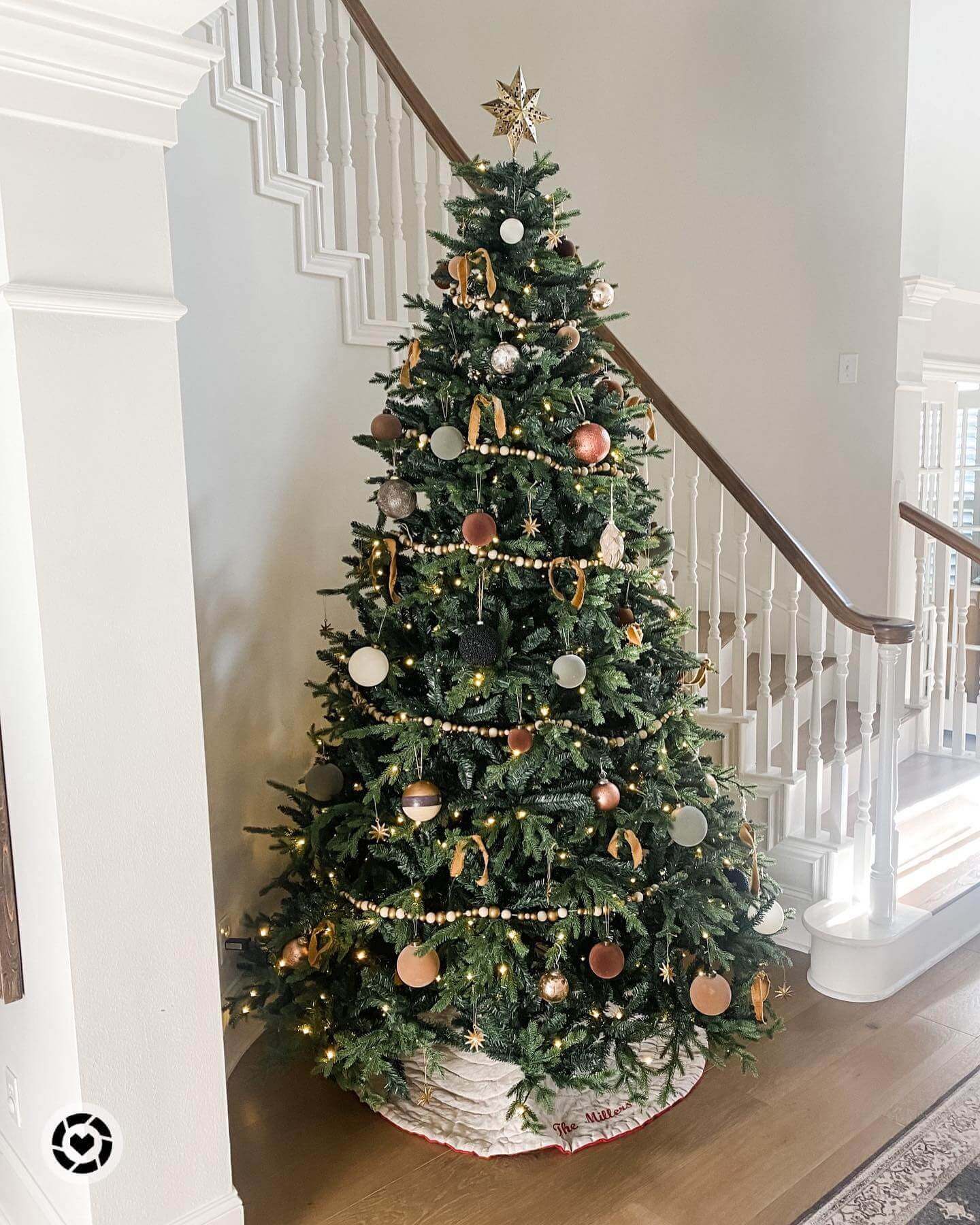  The beautifully realistic premium 9' Scarlet Fir Pre-Lit Artificial Christmas Tree with lights and tree stand
